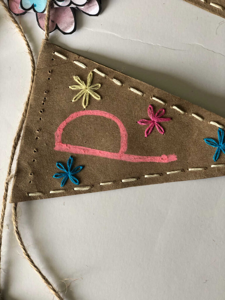 embroidery stitched floral pendant